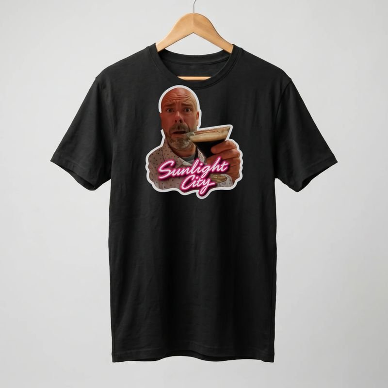 Black tee printed with the espresso martini toast and Sunlight City script